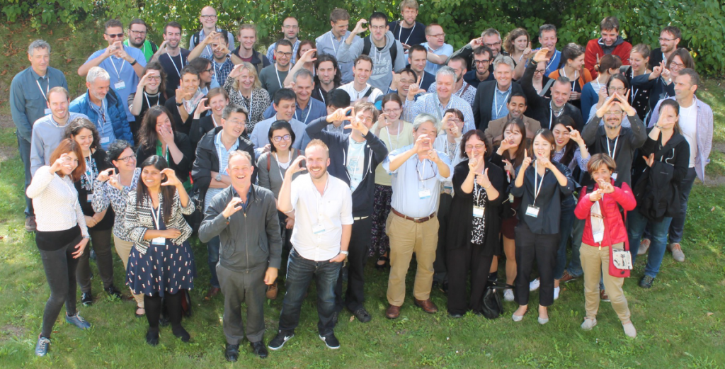 Group of Participants waving and laughing
